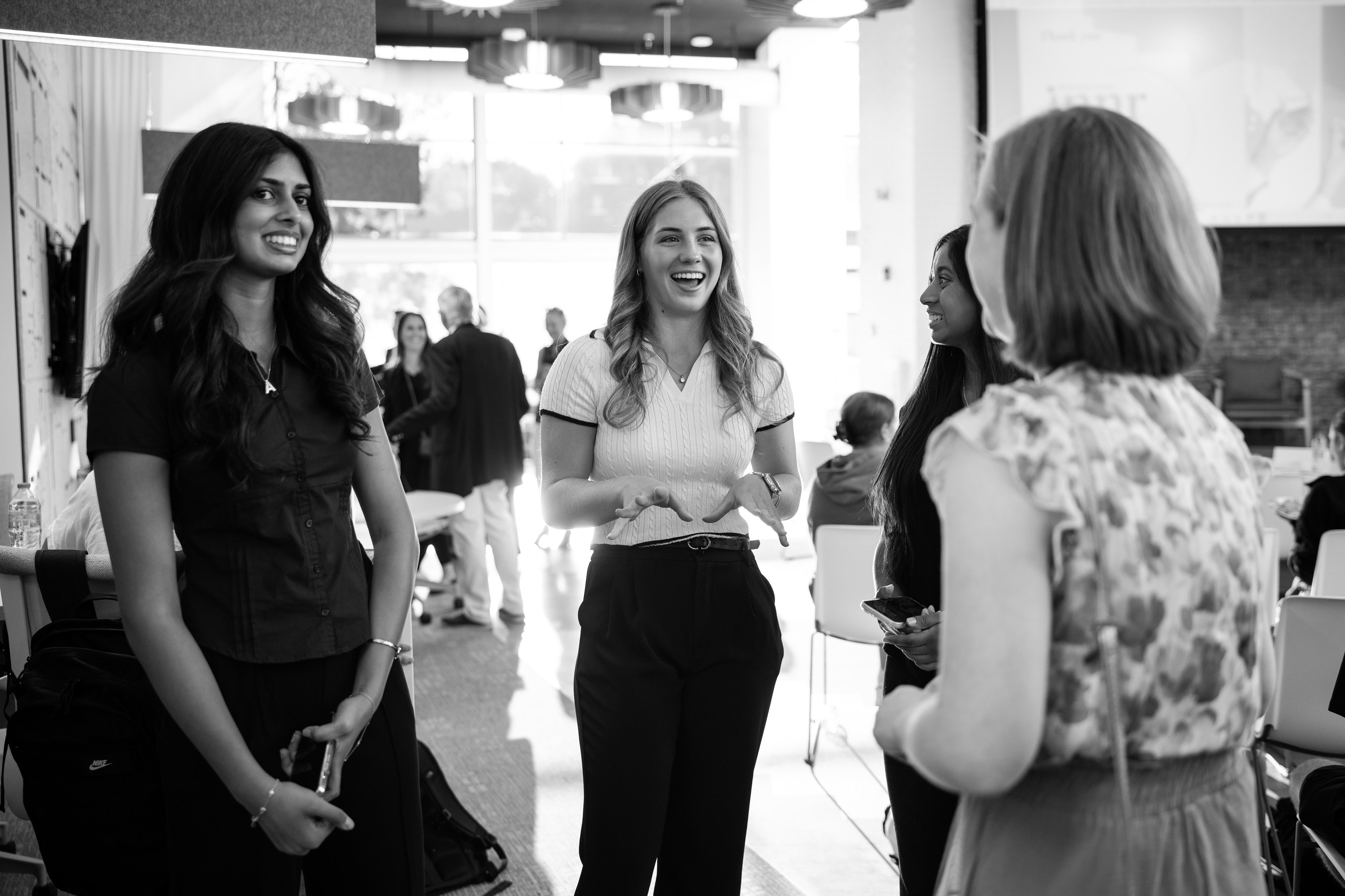 Student founders talking to mentor at event
